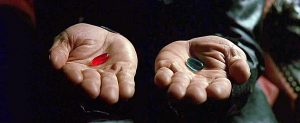 still shot from The Matrix two hands each offering a pill